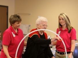 PT April Boles SLP Brittany Brown assist Ruth-Morris